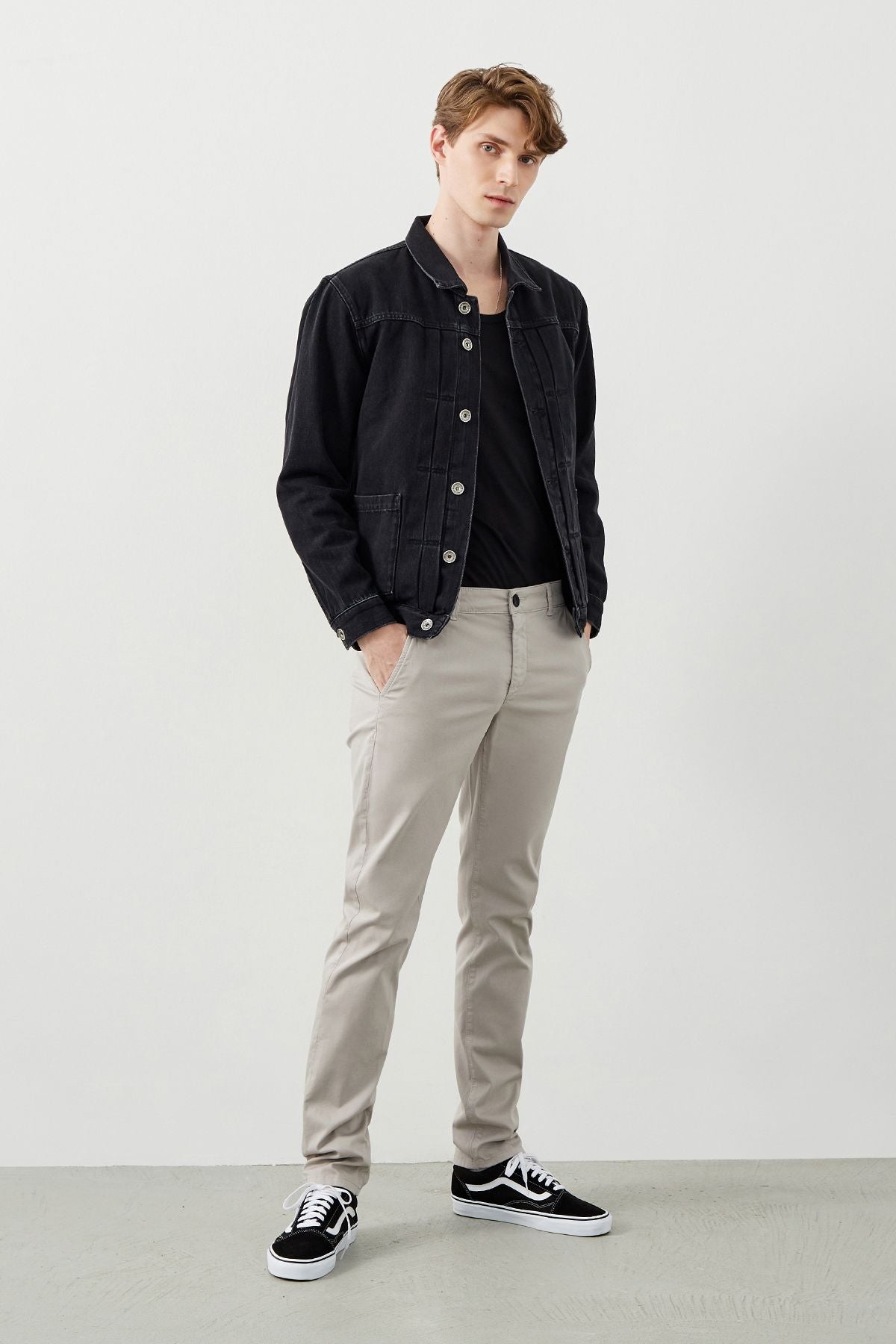 Young man in slim fit grey chinos by RA Denim