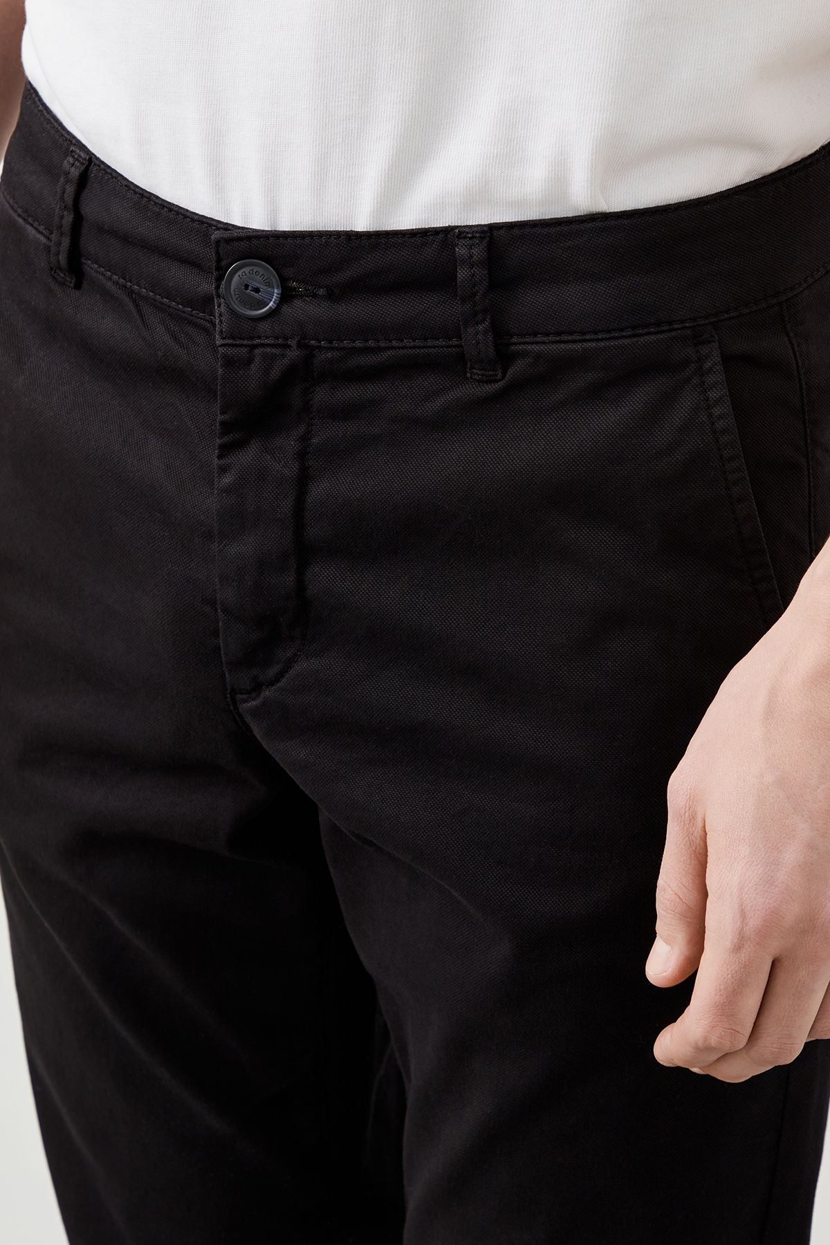 Front view of modern slim fit black chinos for men
