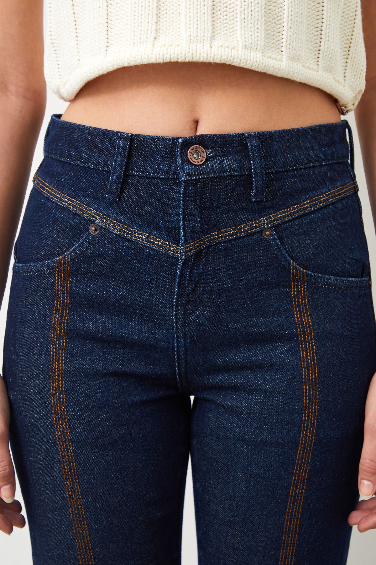 Close-up of brown embroidered lines on Mira Boyfriend Fit Dark Blue Jeans