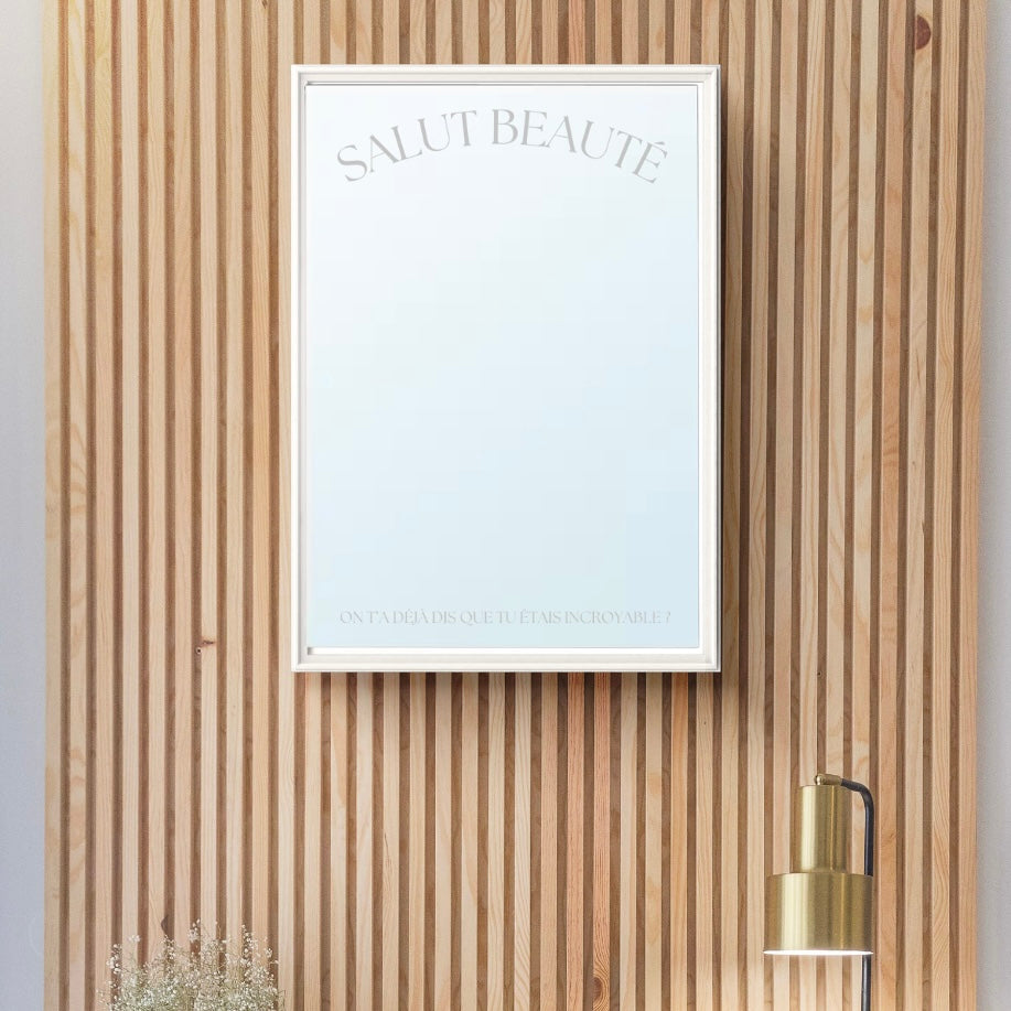 A stylish A4 hanging mirror featuring the phrase 'Hello Beauty' written in silver script.