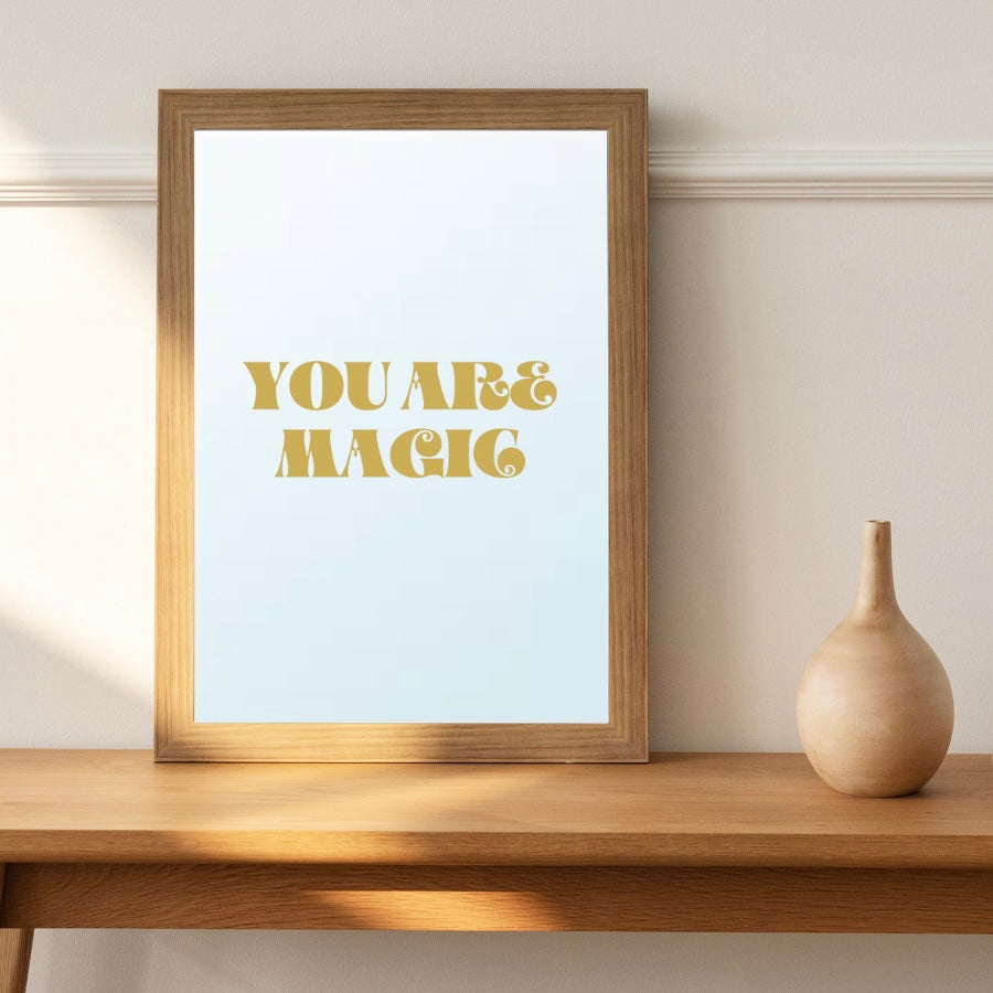 A A4 mirror with the uplifting message 'You are Magic' by French Brand 'Atelier Circe' displayed on a shelf