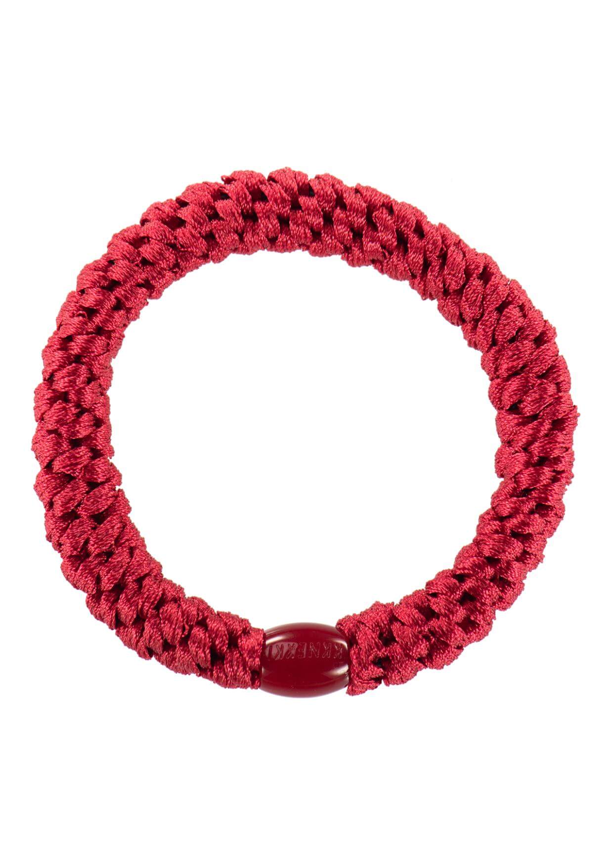 Bold Red Kknekki Hair Elastic Securing a Stylish Ponytail – Strong, Soft & Perfect for Any Occasion