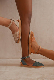 Woman wearing the Chetumal huaraches, showcasing their flexible fit and vibrant colors.