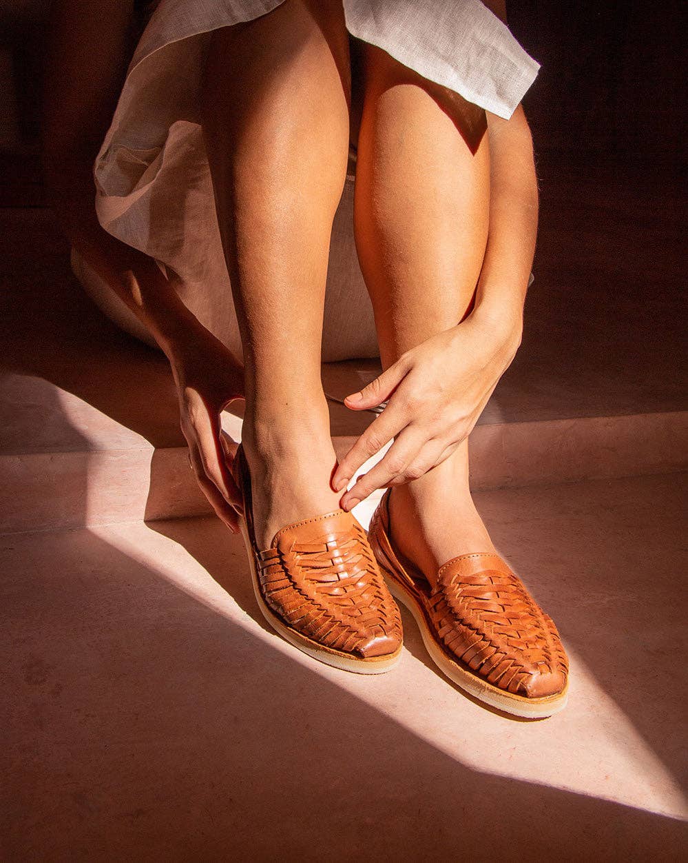Woman wearing the SAHUAYO huaraches, showcasing their flexible and comfortable fit.