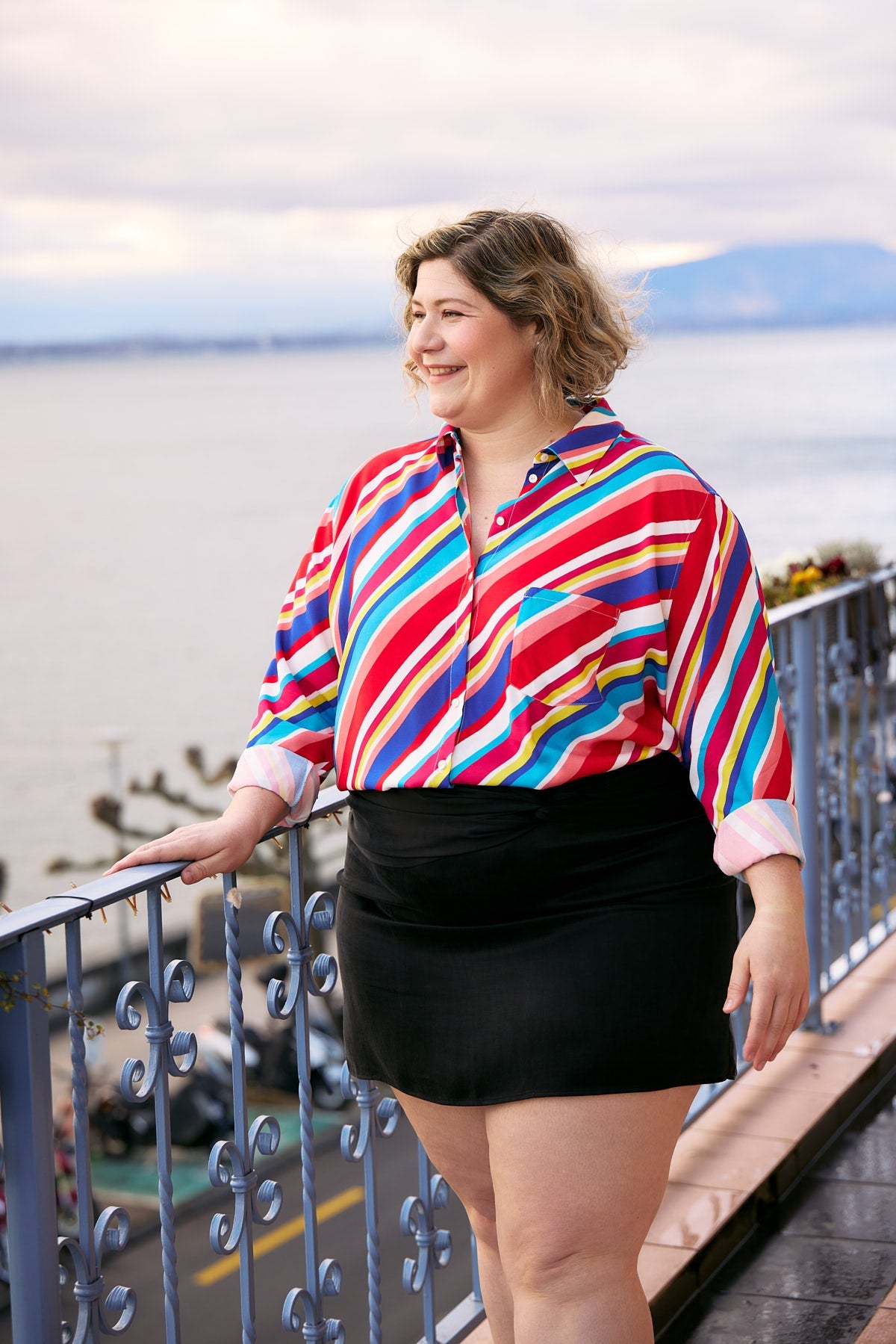 Plus Size Woman wearing Aloha shirt  with vibrant multicolor stripes