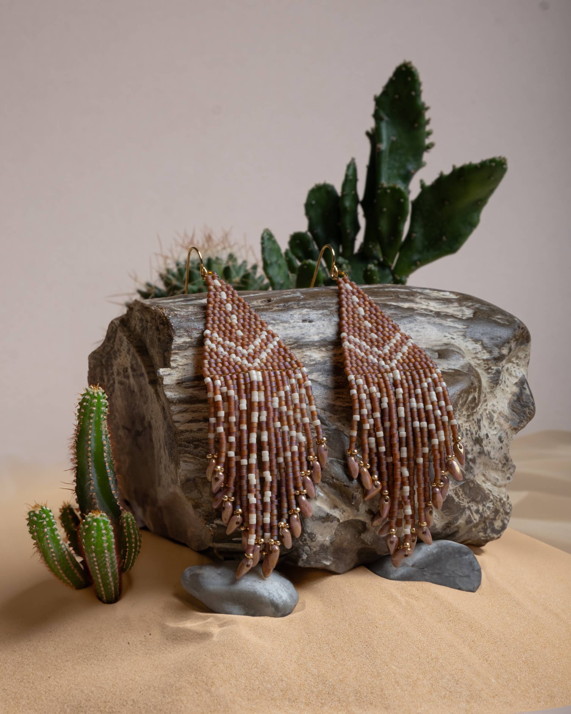 Mayana Designs Beaded Handwoven Taos Fringe Earrings in Light Brown on display. Highlighting the intricate beadwork and fringe design