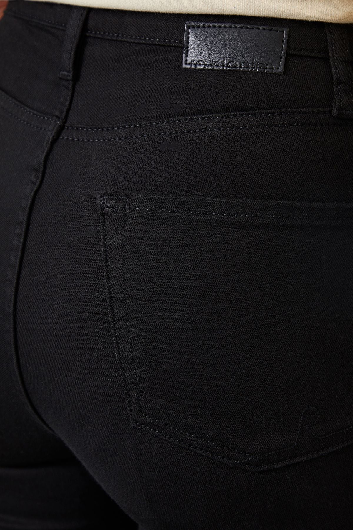 Close-up of the luxurious comfort stretch cotton blend fabric of ZEL Stay Black Jeans in a rich super dark black wash.