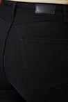 Close-up of the luxurious comfort stretch cotton blend fabric of ZEL Stay Black Jeans in a rich super dark black wash.