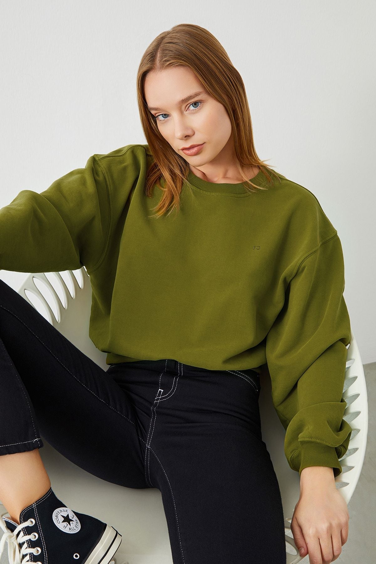 Stylish Woman in Green VITA Avocado Crop Sweatshirt - Fashionably Eco-Friendly