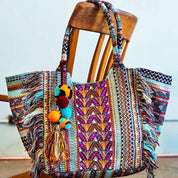 A bold mix of turquoise, lilac, and orange meets exquisite beadwork and sequins in the handcrafted Smitten Lali Bag—your go-to statement accessory