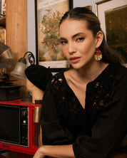 Woman wearing Beaded Handwoven Santa Fe Drops, highlighting the geometric pattern and vibrant colors.