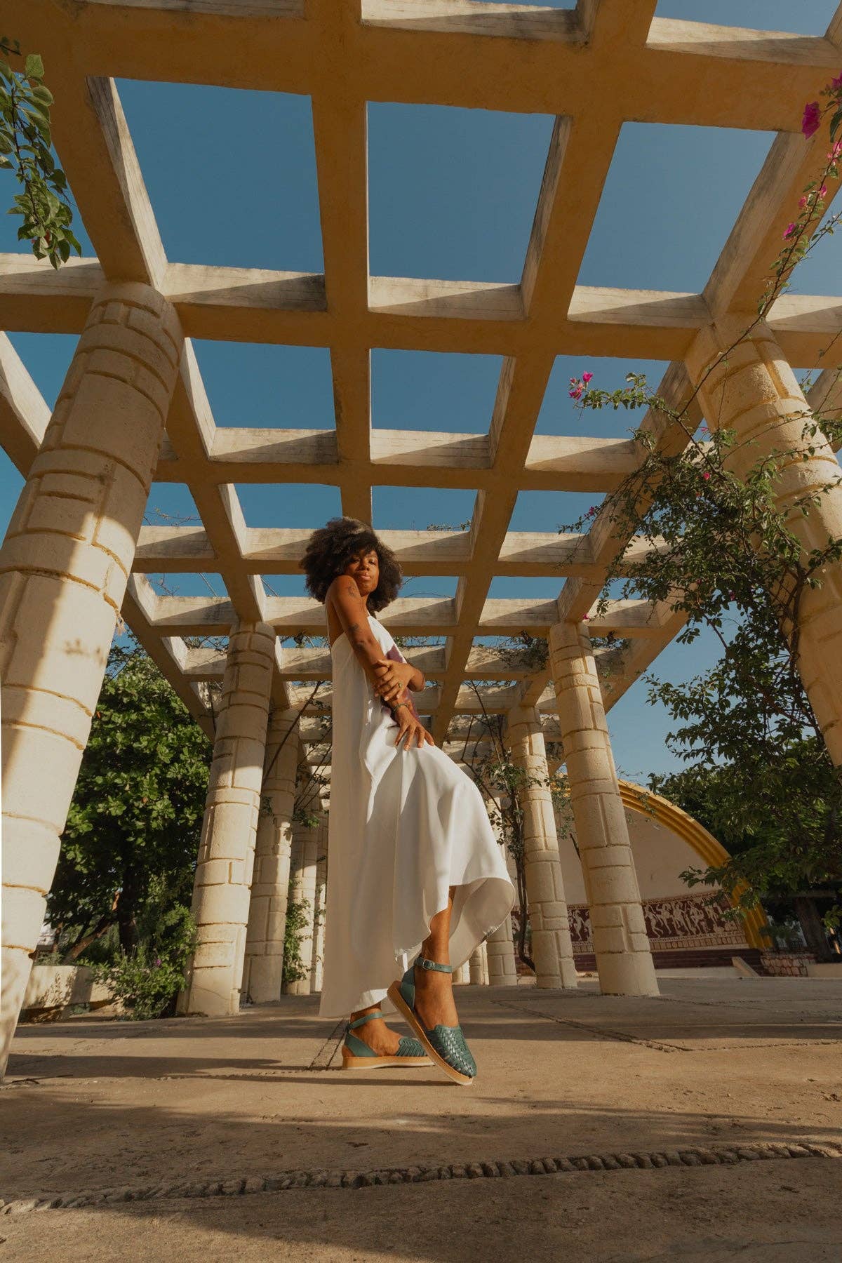 Chetumal Green Huaraches styled with a white summer dress for a laid-back look.