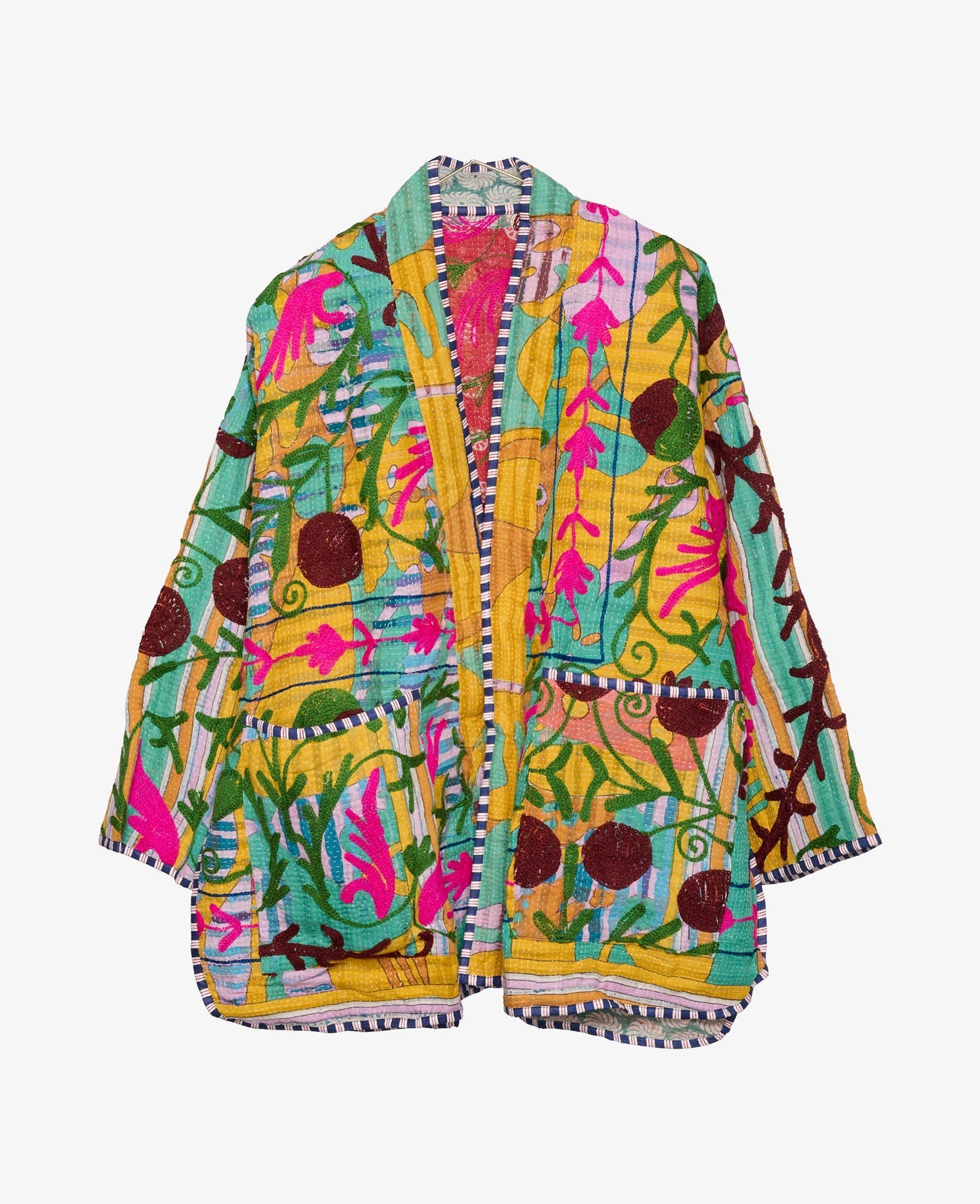 A brightly colored women's jacket embroidered with flowers and leaves by Sissel Edelbo