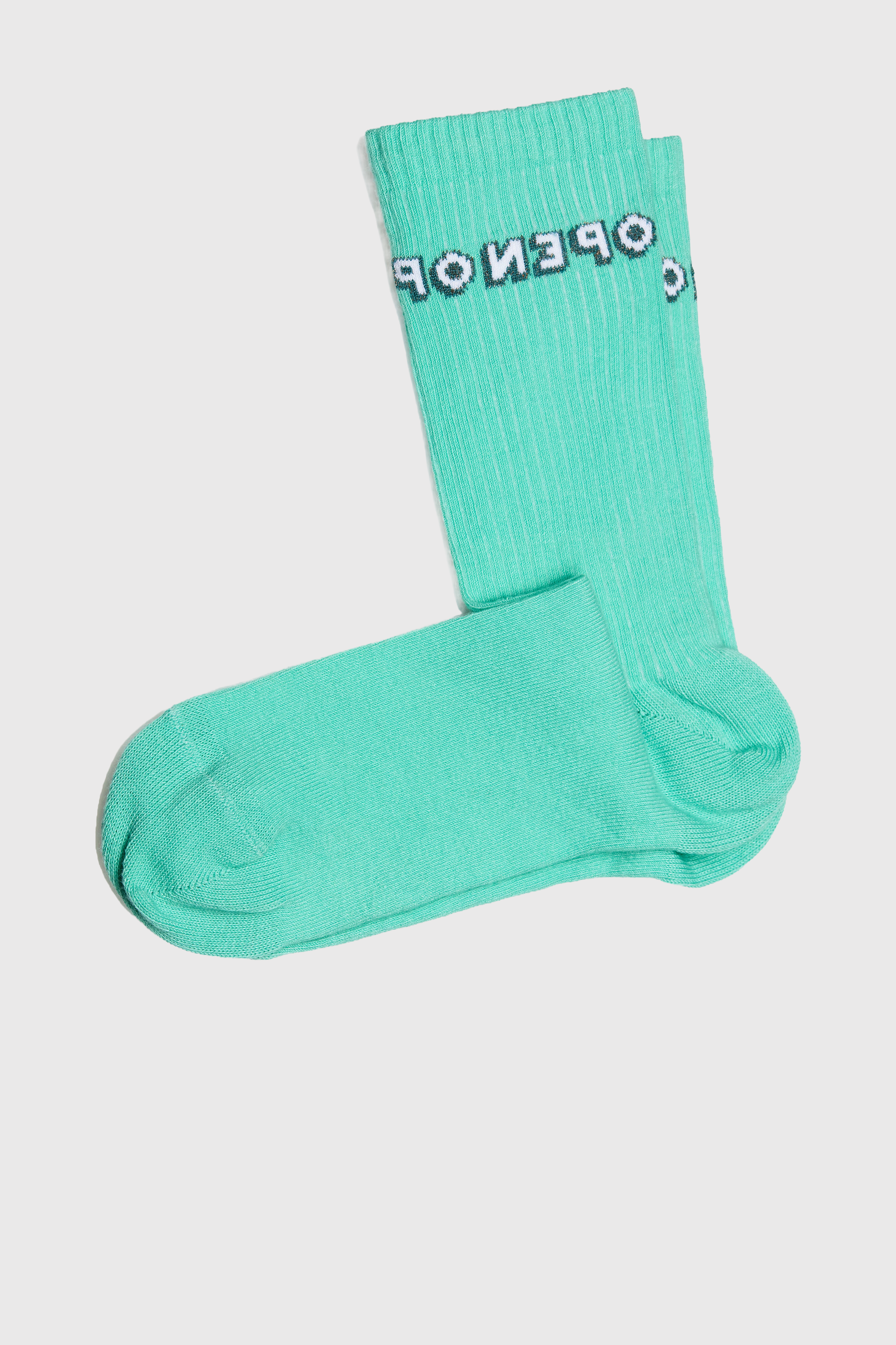 A pair of Turquoise green cotton socks with the word open