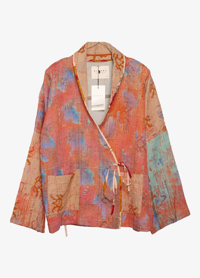 An orange and blue women's jacket with a tie-in front, upcylced from Kantha fabric.