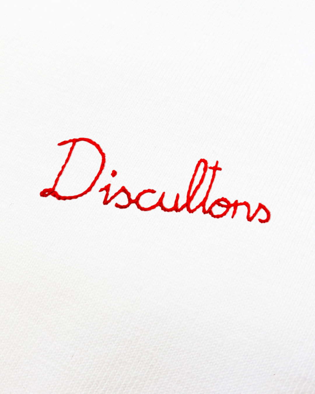 Hand Embroidered Slogan in Red - Discultons- on White T-Shirt