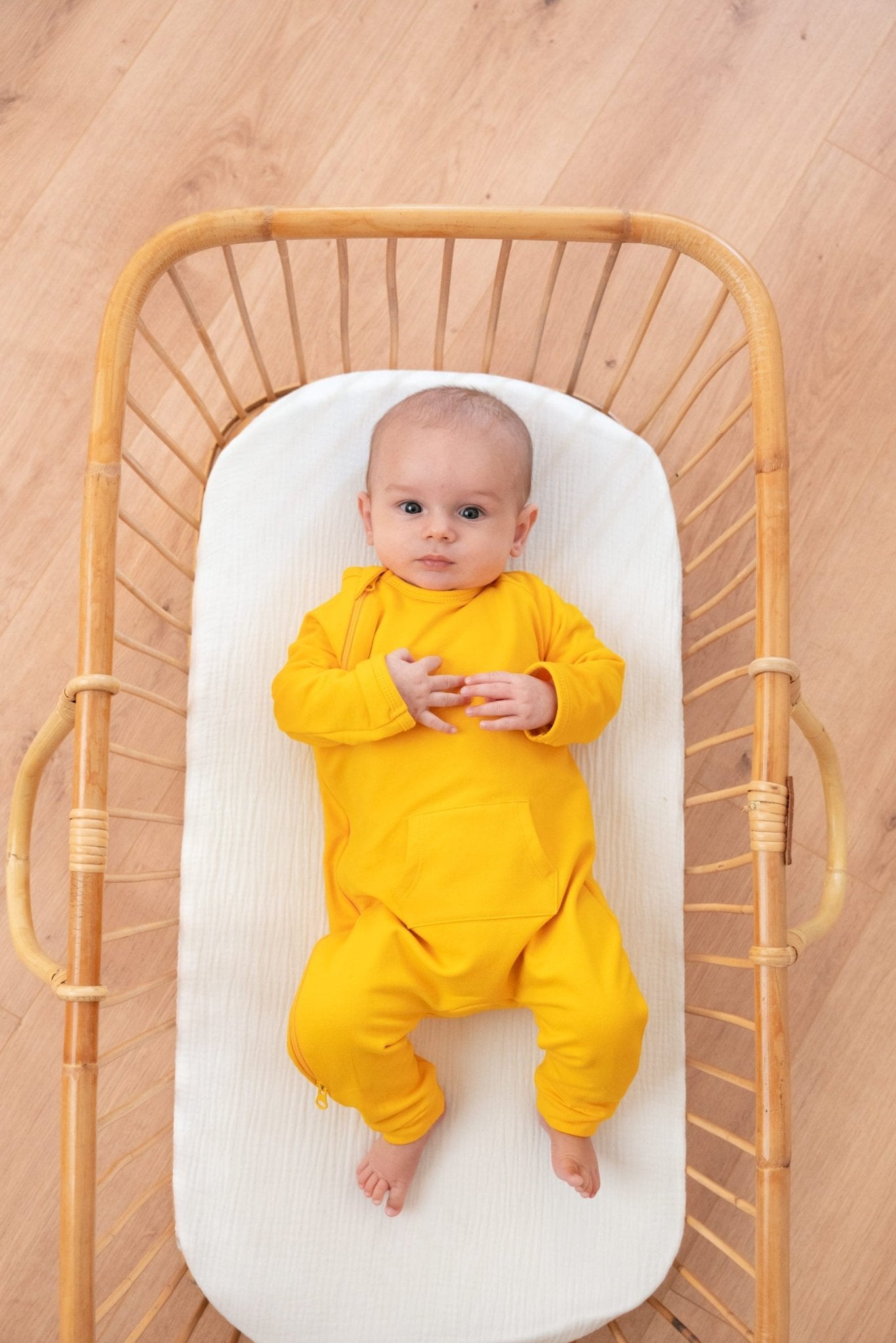 baby in Tilouco's Mustard Yellow Baby Grow