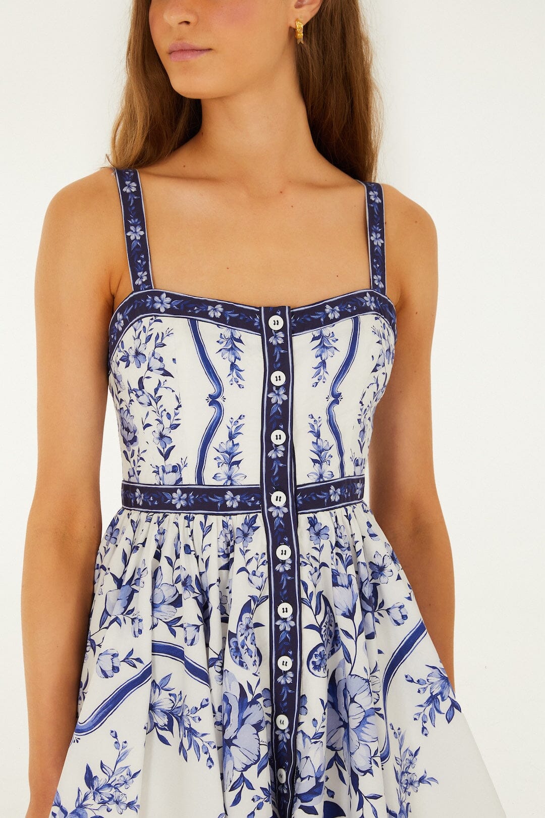 Detailed view of the hand-painted floral print and buttoned front on the Farm Rio Porcelain Garden mini dress