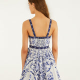 Full body view of a model styling the off-white Farm Rio Porcelain Garden mini dress