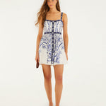 Back view of a model wearing the Farm Rio off-white Porcelain Garden mini dress