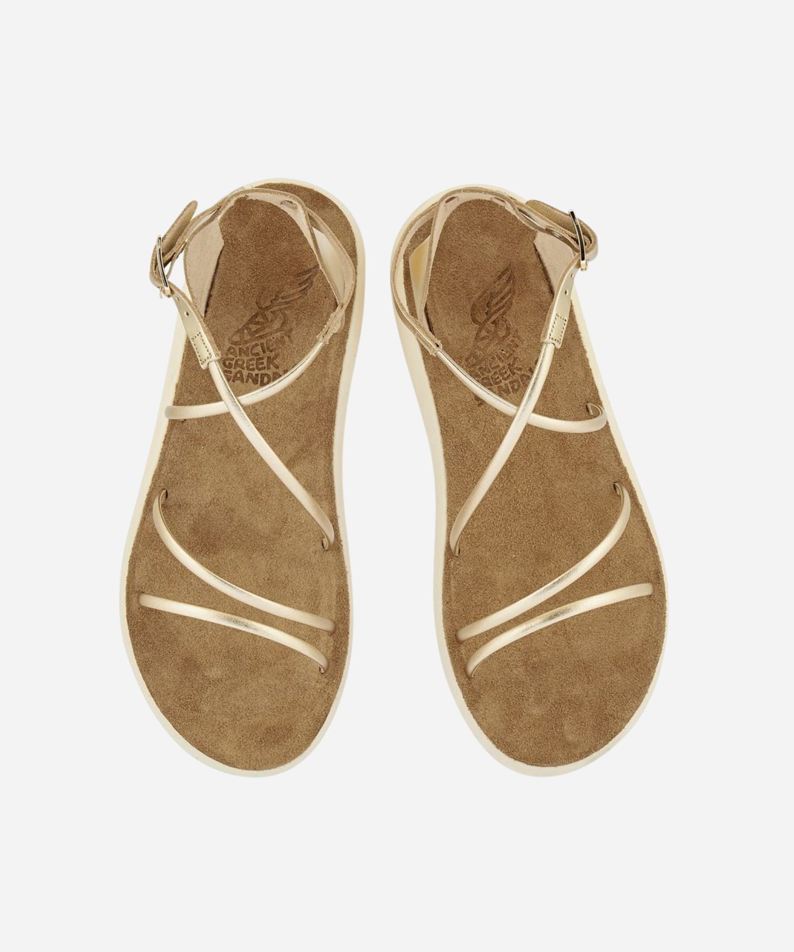 Top view of a pair of Anastasia Comfort platinum sandals with crossover metallic straps and suede-lined footbeds
