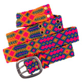 Close-up view of the intricate geometric patterns on the Adriana Festival Belt in neon pink and  blue.