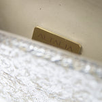 An open view of the Ary Bag, revealing its cream-colored vintage nappa interior