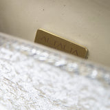 An open view of the Ary Bag, revealing its cream-colored vintage nappa interior