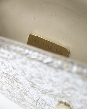 An open view of the Ary Bag, revealing its cream-colored vintage nappa interior
