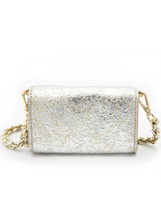 A back-facing view of the Ary Bag, showcasing its silver sheepskin leather