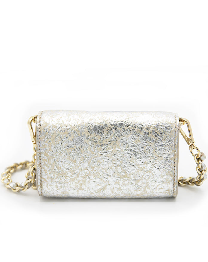 A back-facing view of the Ary Bag, showcasing its silver sheepskin leather