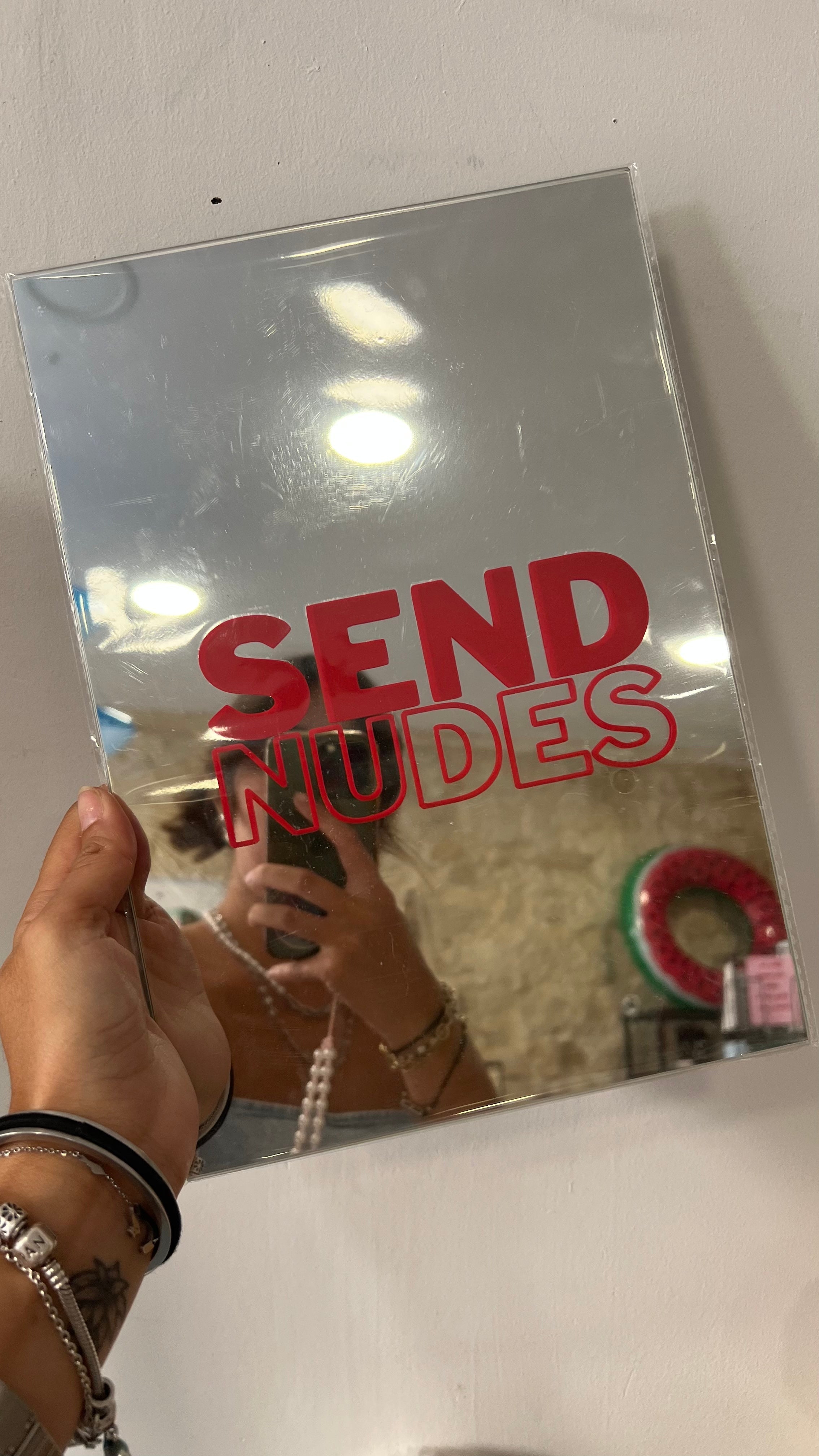 A4 handmade mirror featuring the fun phrase 'Send nudes' in bold red lettering.