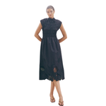 Black sleeveless MMAria Mono dress in breathable organic cotton featuring a smocked bodice and intricate floral embroidery. Ideal for sustainable summer occasion styling.