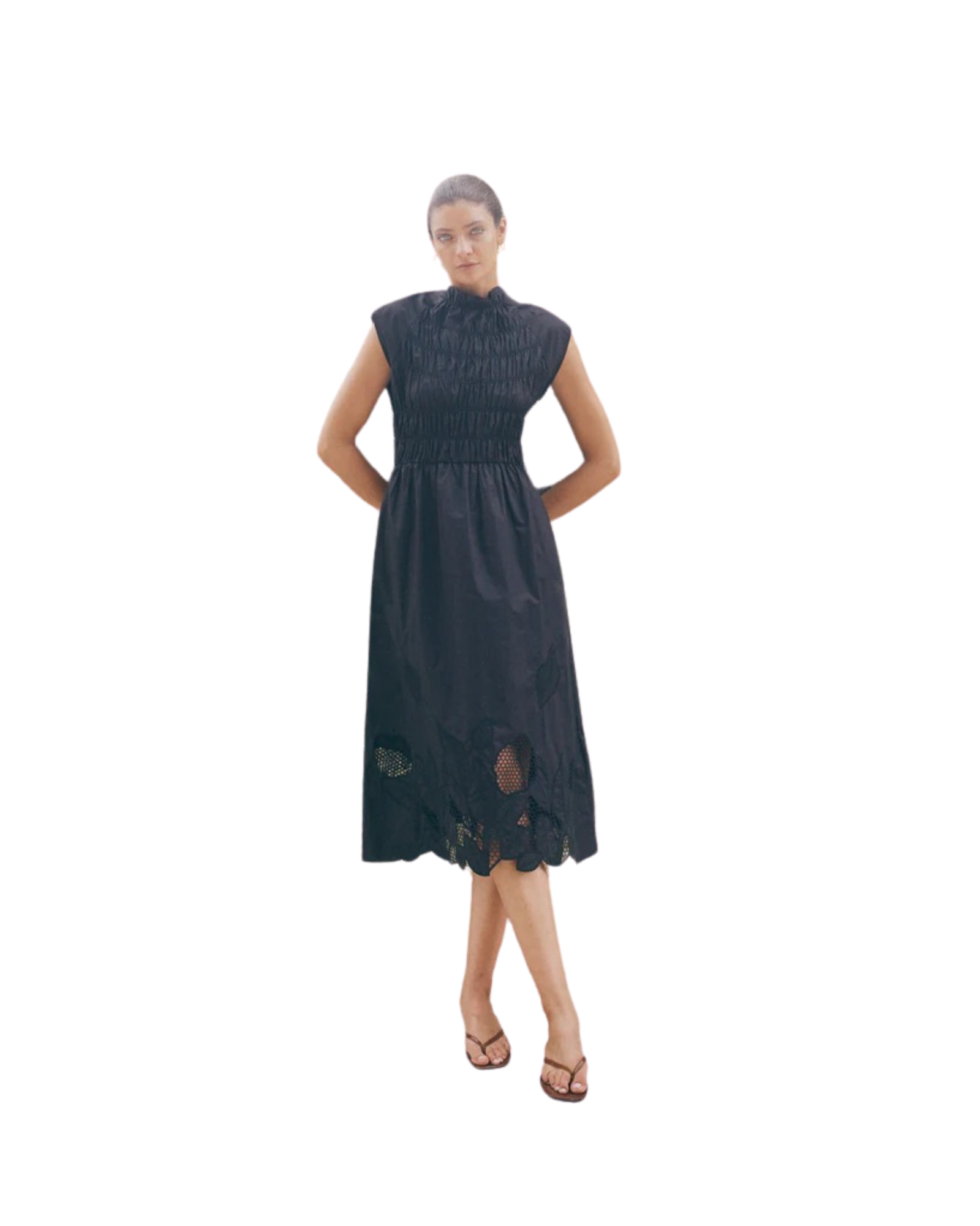 Black sleeveless MMAria Mono dress in breathable organic cotton featuring a smocked bodice and intricate floral embroidery. Ideal for sustainable summer occasion styling.