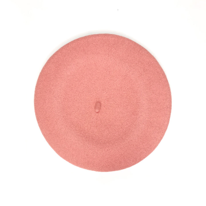  100% merino wool beret in pink, showcasing its hand-embroidered details and luxurious texture