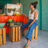 MEXAS braided leather loafers styled with a blouse and jeans.