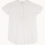 Close-up detail of white fabric and neckline of Freya top