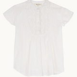 Close-up detail of white fabric and neckline of Freya top