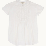Close-up detail of white fabric and neckline of Freya top