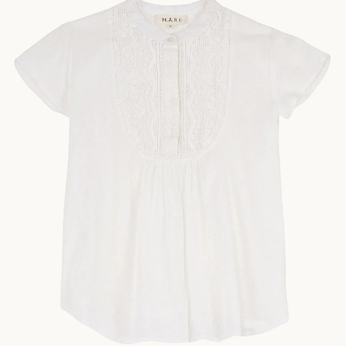 Close-up detail of white fabric and neckline of Freya top