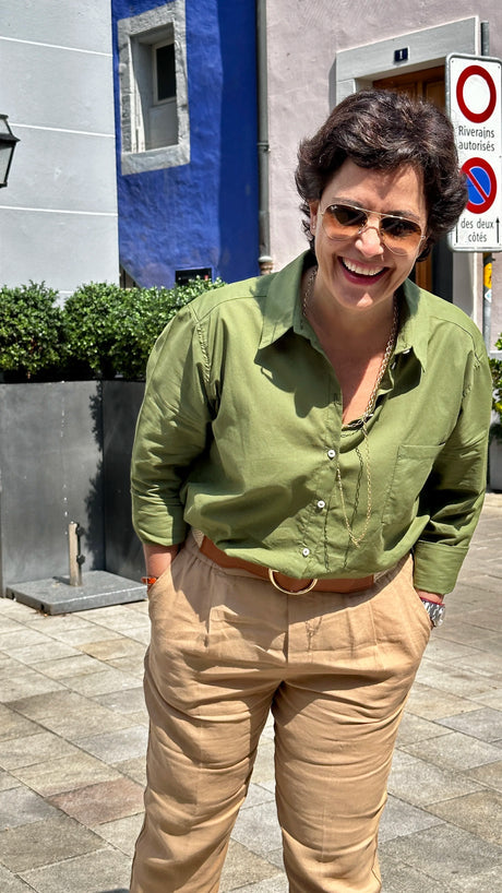 Woman in the sunshine wearing a green summer shirt