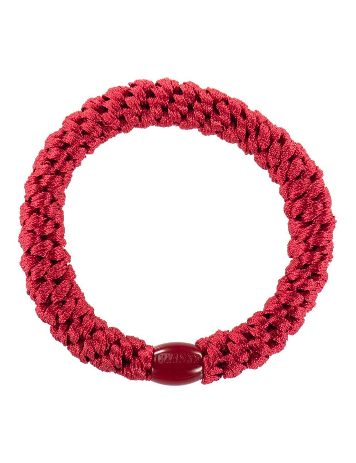 Bold Red Kknekki Hair Elastic Securing a Stylish Ponytail – Strong, Soft & Perfect for Any Occasion
