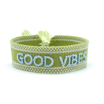 Close-up of adjustable cornflower blue woven bracelet with embroidered “LIVE LOVE SHINE” lettering and sliding knot tassel cords.