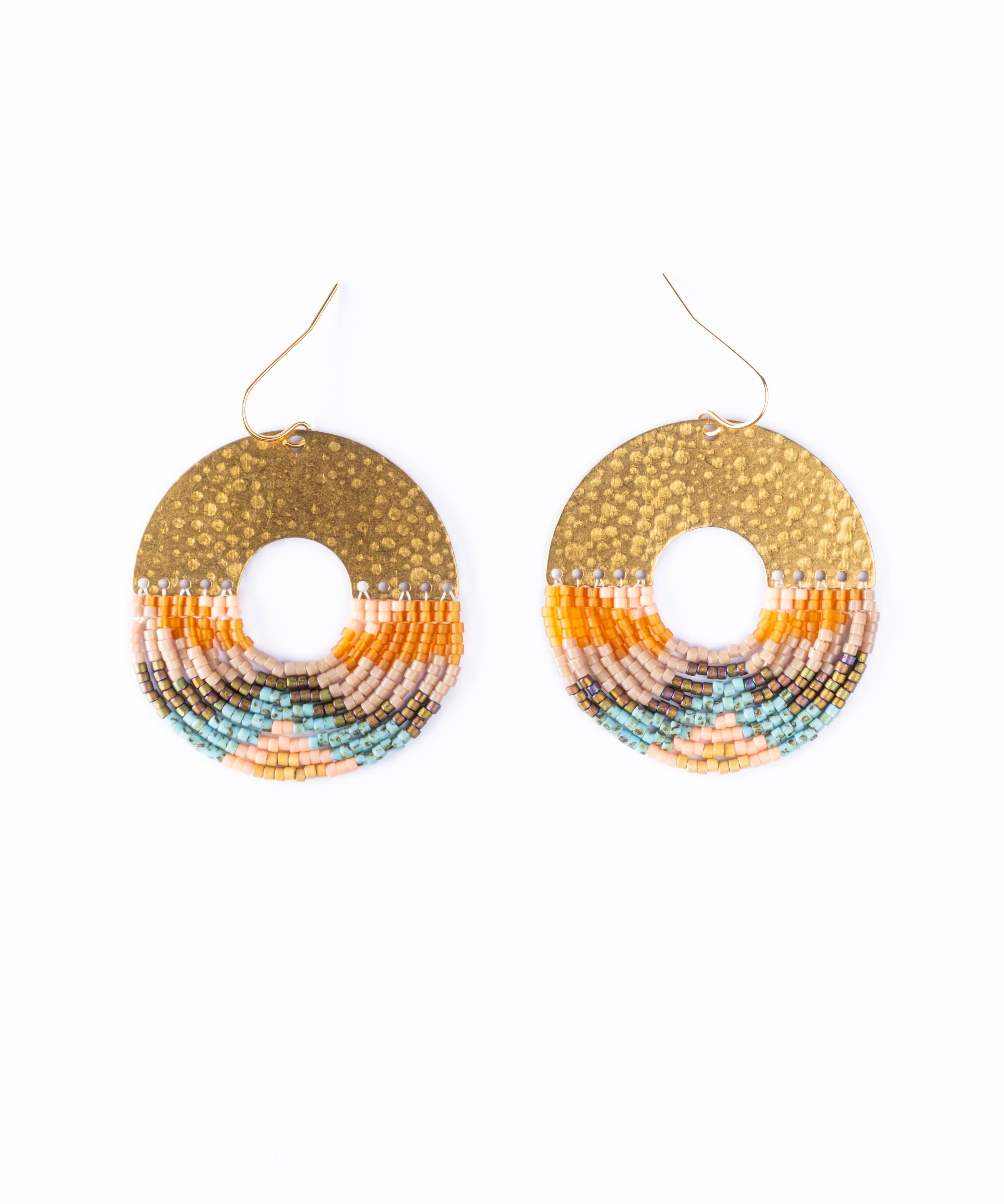 Mayana Designs Earth Ombre Fringe Disk Earrings, showcasing vibrant peach, orange, and turquoise beads with a hammered brass arch