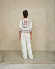Model styling Ecru multi jacket with denim in relaxed everyday outfit 