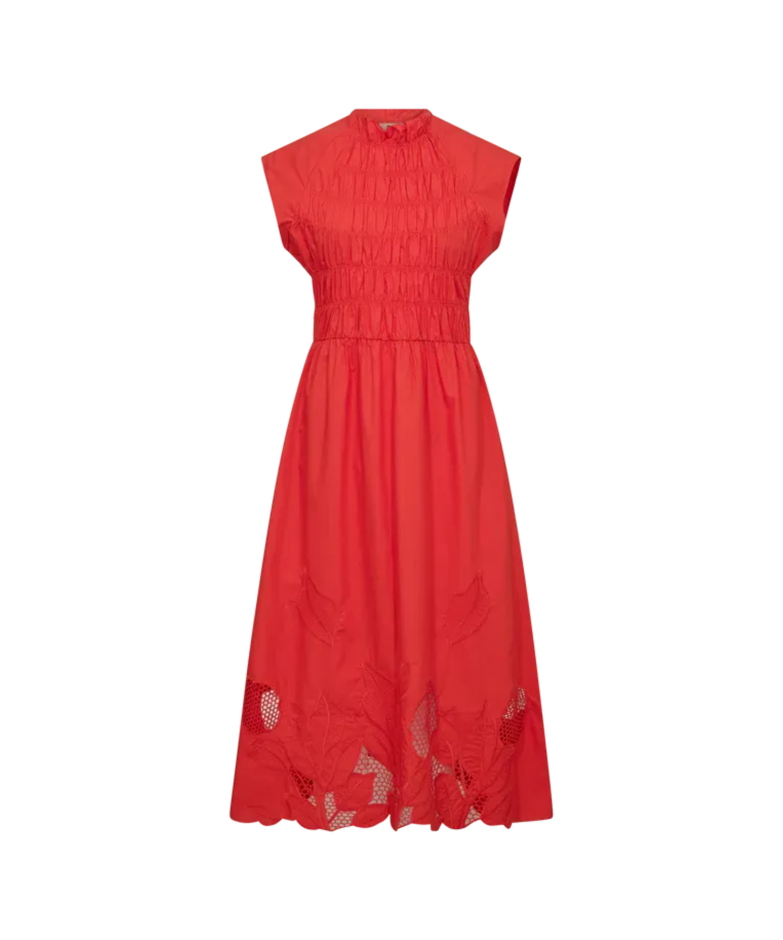 Model sitting wearing MMAria Mono Dress in Soft Coral, embroidered detail visible
