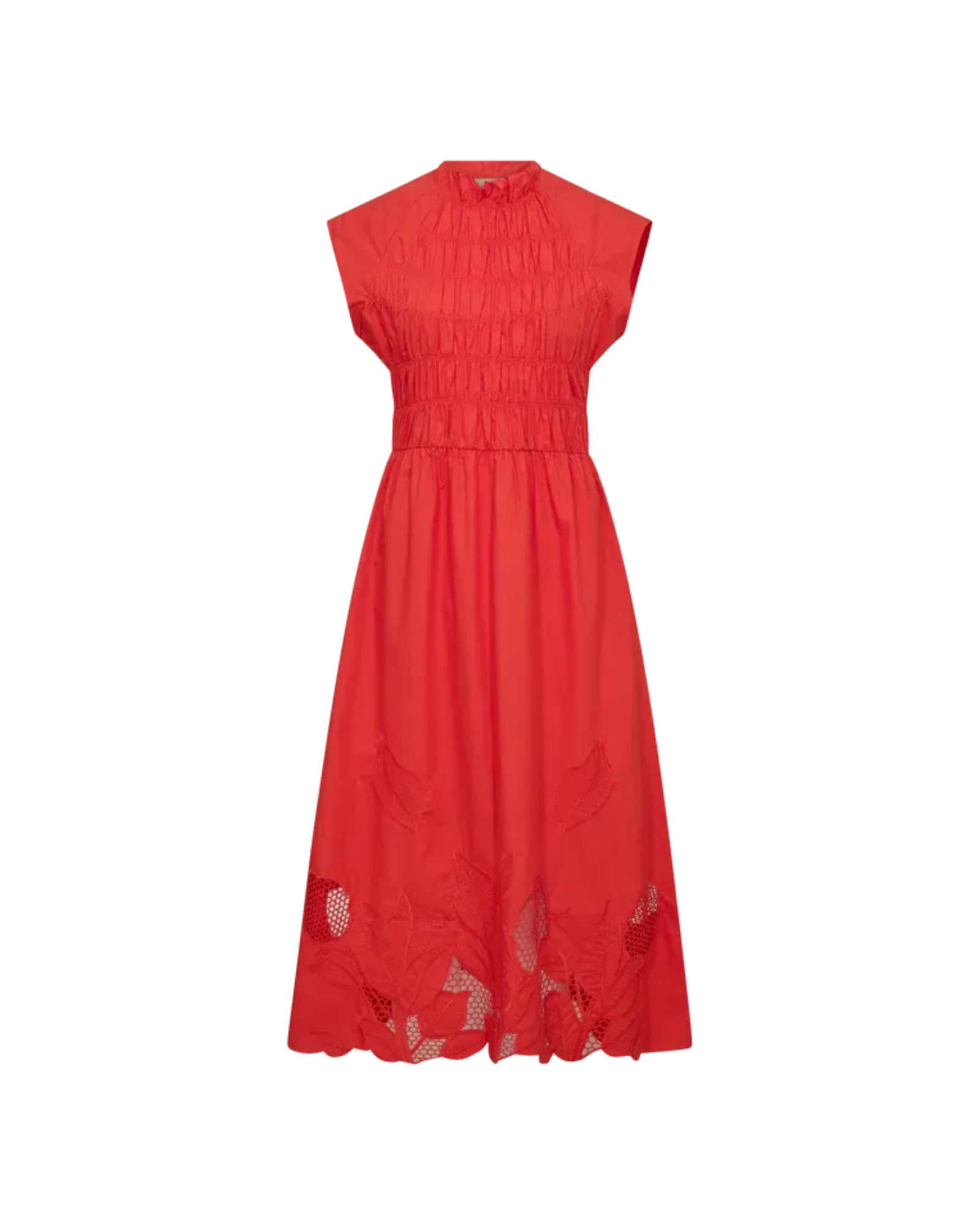 Model sitting wearing MMAria Mono Dress in Soft Coral, embroidered detail visible