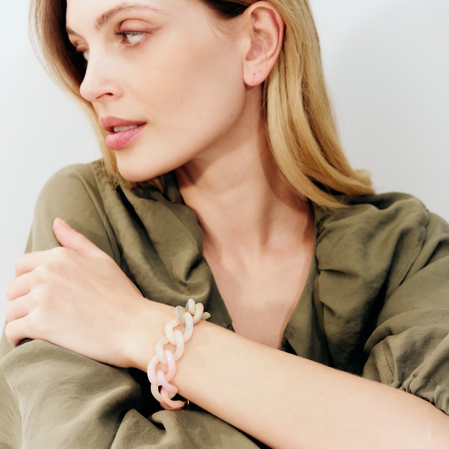 Woman wears Vanessa Baroni Neon Rainbow  Mini Flat Chain Bracelet 