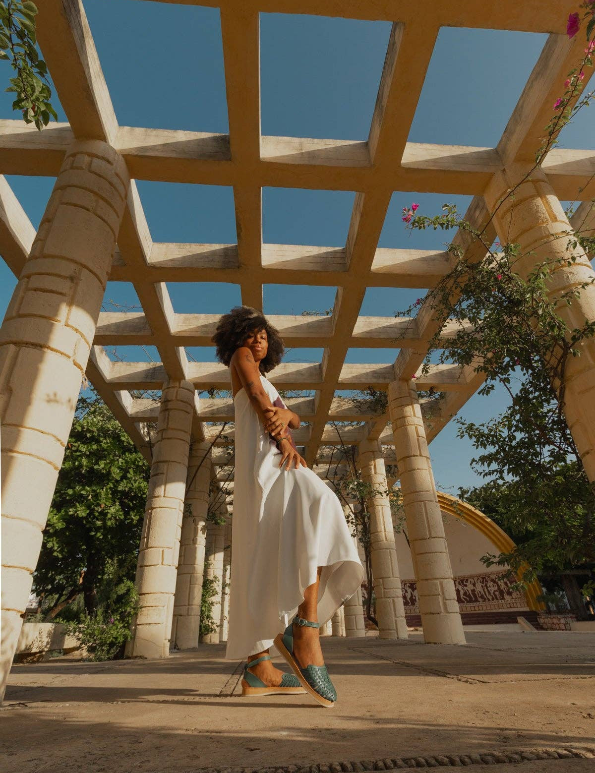 Chetumal Green Huaraches styled with a white summer dress for a laid-back look.