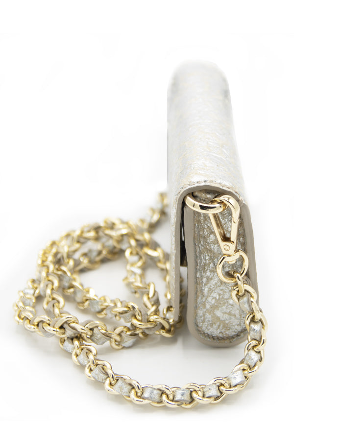 A side profile of the Ary Bag, highlighting its compact dimensions and elegant gold chain strap.